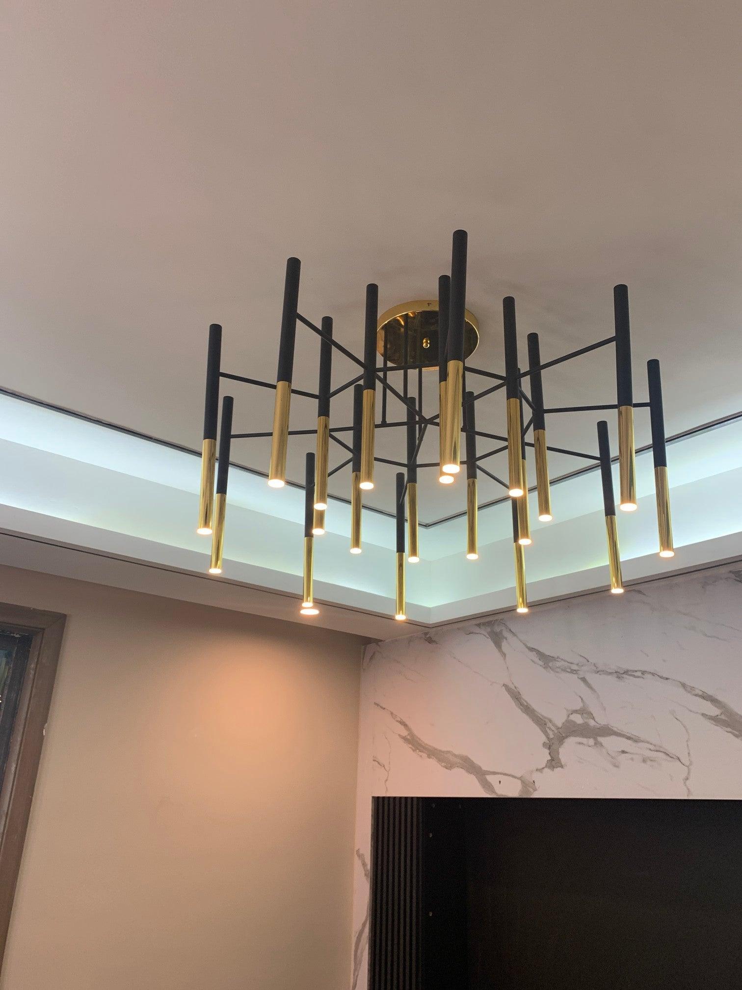 Solara Moderner Kronleuchter Stäbe Schwarz-Gold-Letslighting